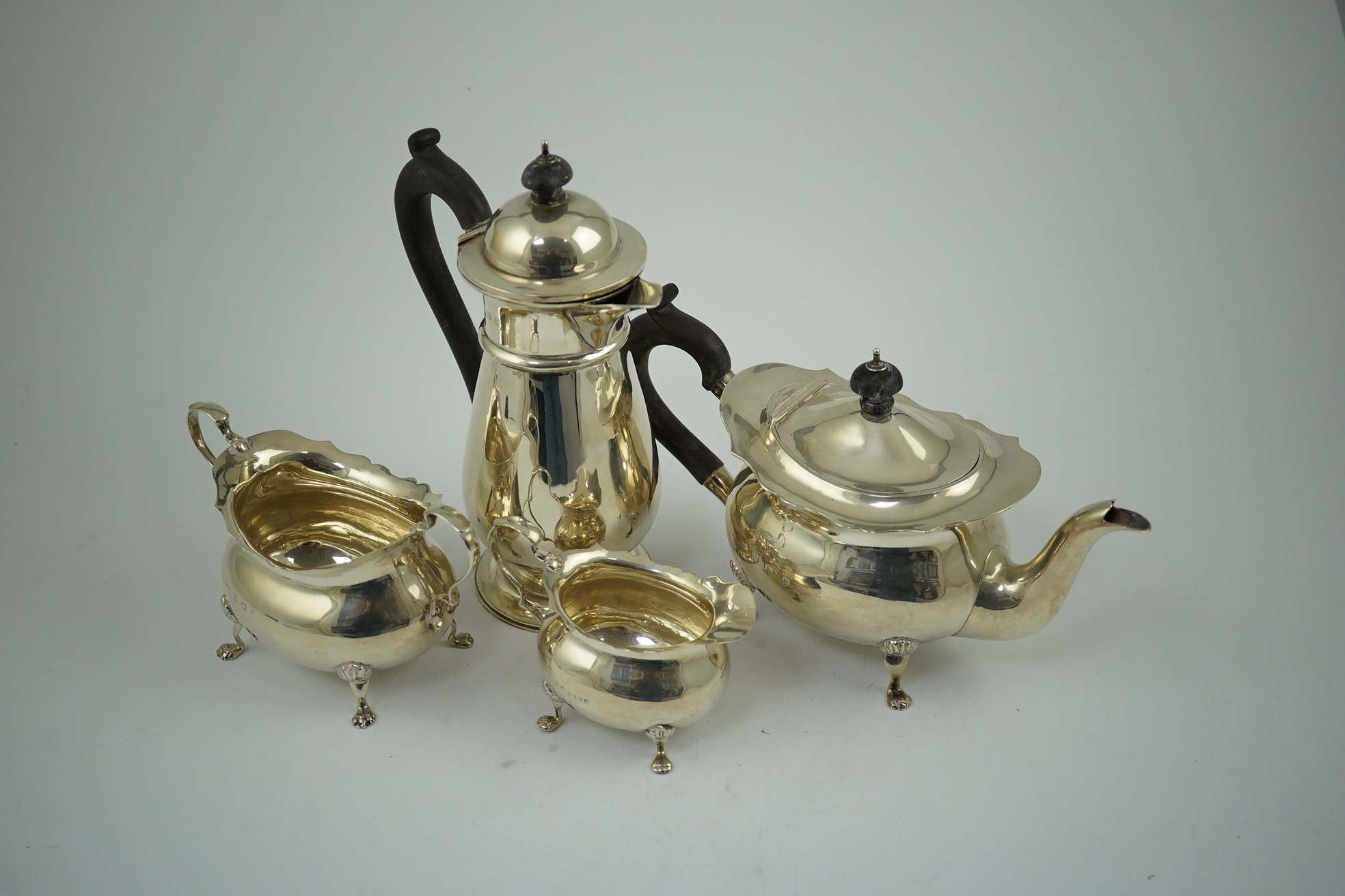 A late Victorian silver four piece tea set by Walker & Hall